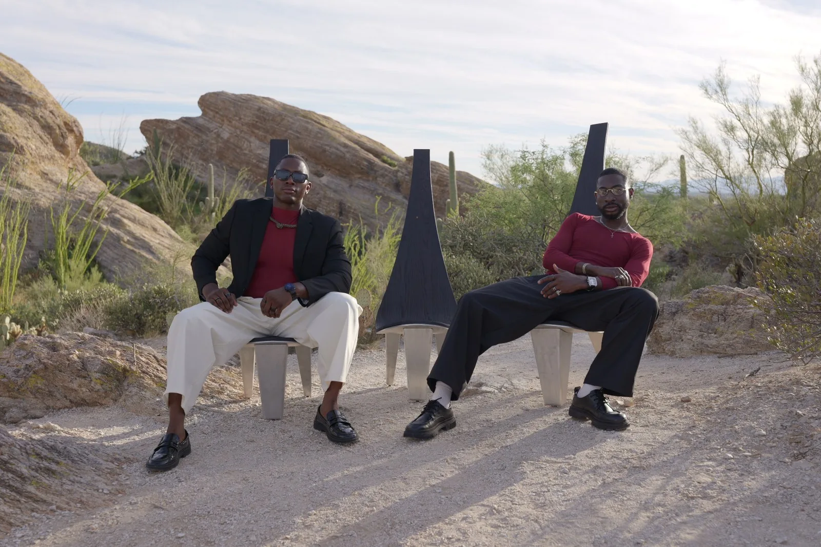 Two chairs in relation to the body and desert landscape